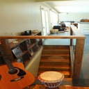 Custom Built Railing with Glass and Stair Wall Shelving - With Walnut Finish